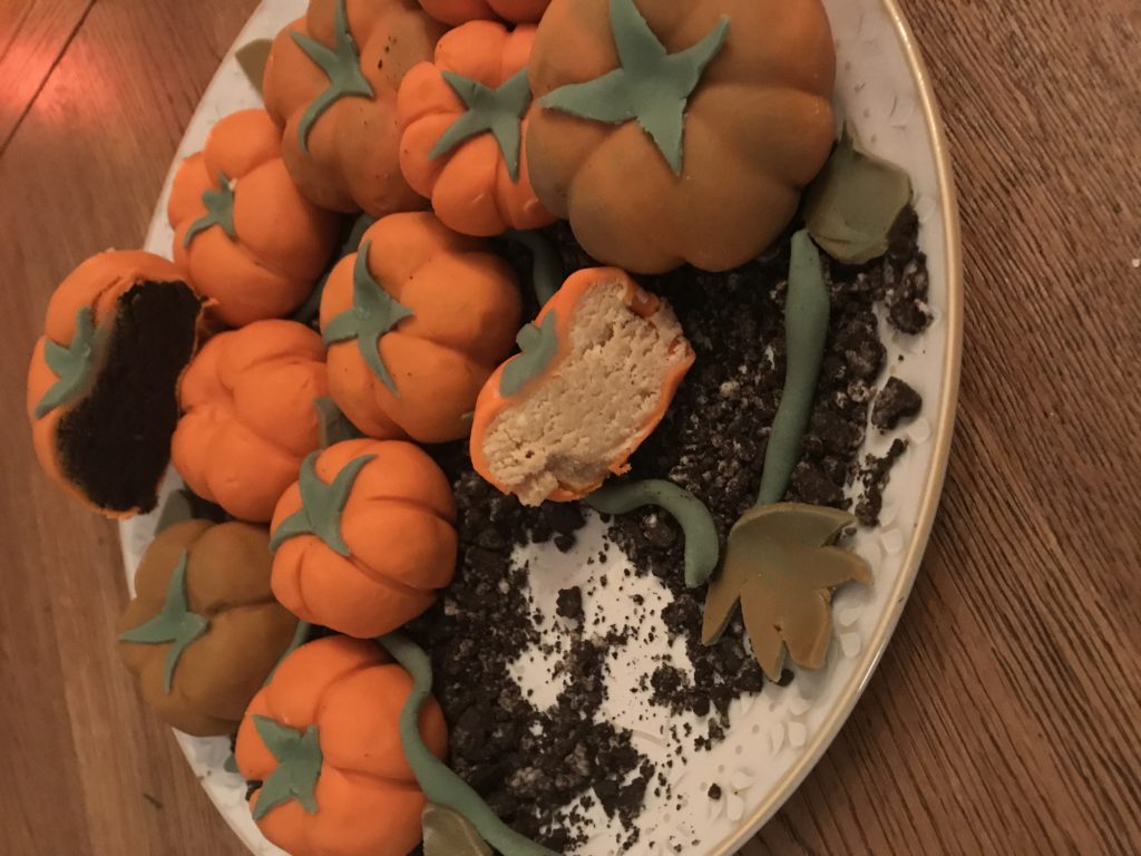 Biscuit cheesecake pumpkins on Oreo biscuit soil