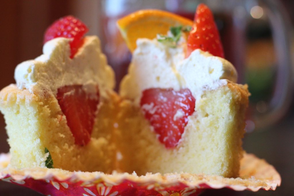 Cupcake filled with Pimms soaked strawberry